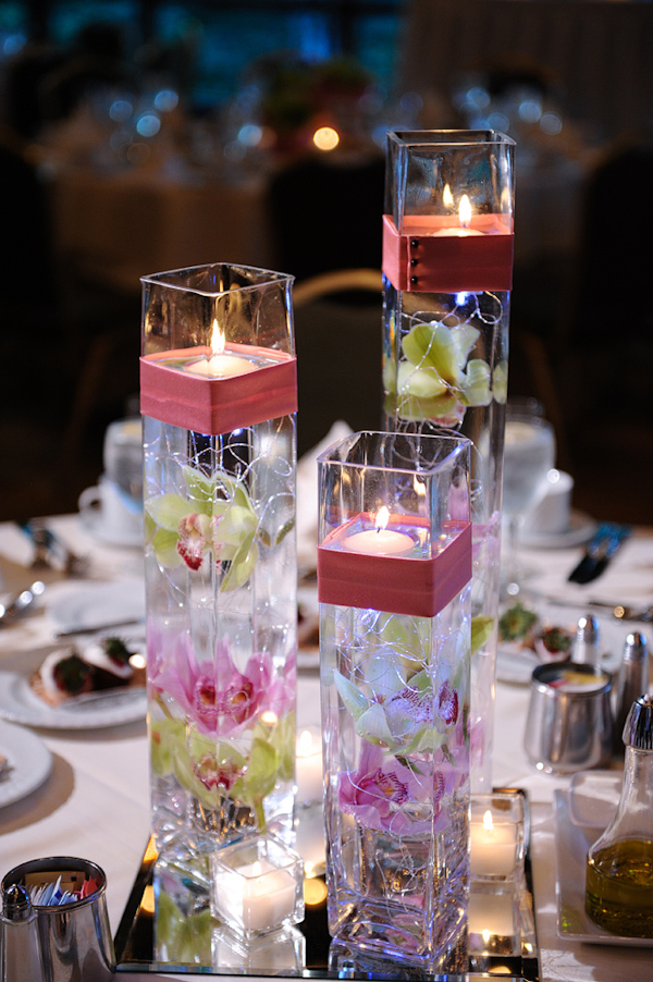 Orchid and candle centerpieces - wedding photo by Kenny Nakai Photography